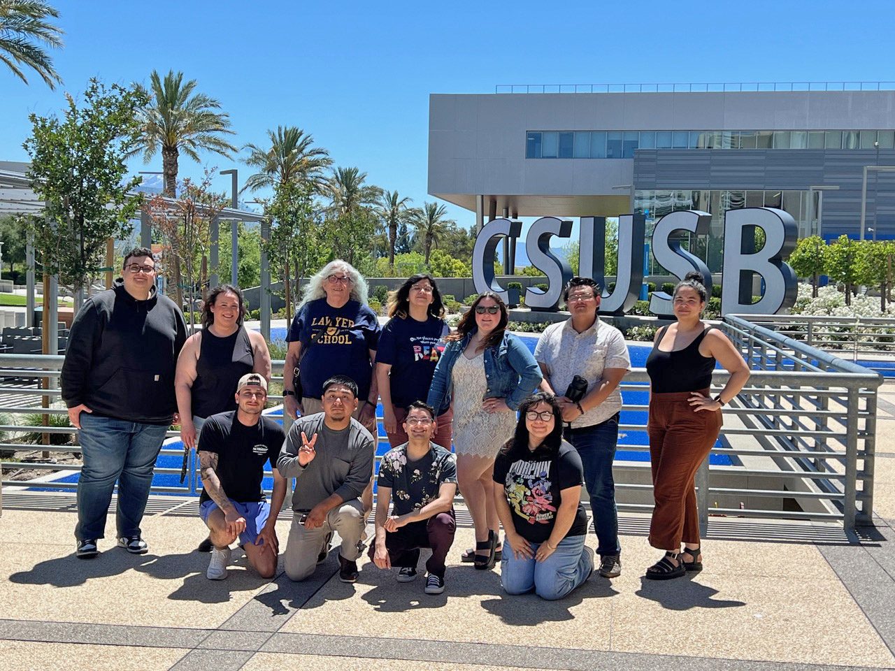 The 2025 History in the Making editorial staff. Back row from left, Bshara Alsheikh, Christina Monson, Randi Stoner, Ahlys Gandara, Erin Maddex, Moises Leon and Margaret Phillips; front row kneeling, Samuel Griffin, Gustavo Alonso, Ayden Kelly and Marlet Felix. Not pictured: Allen Hall, Isai Martinez, and Jessie Zepeda.